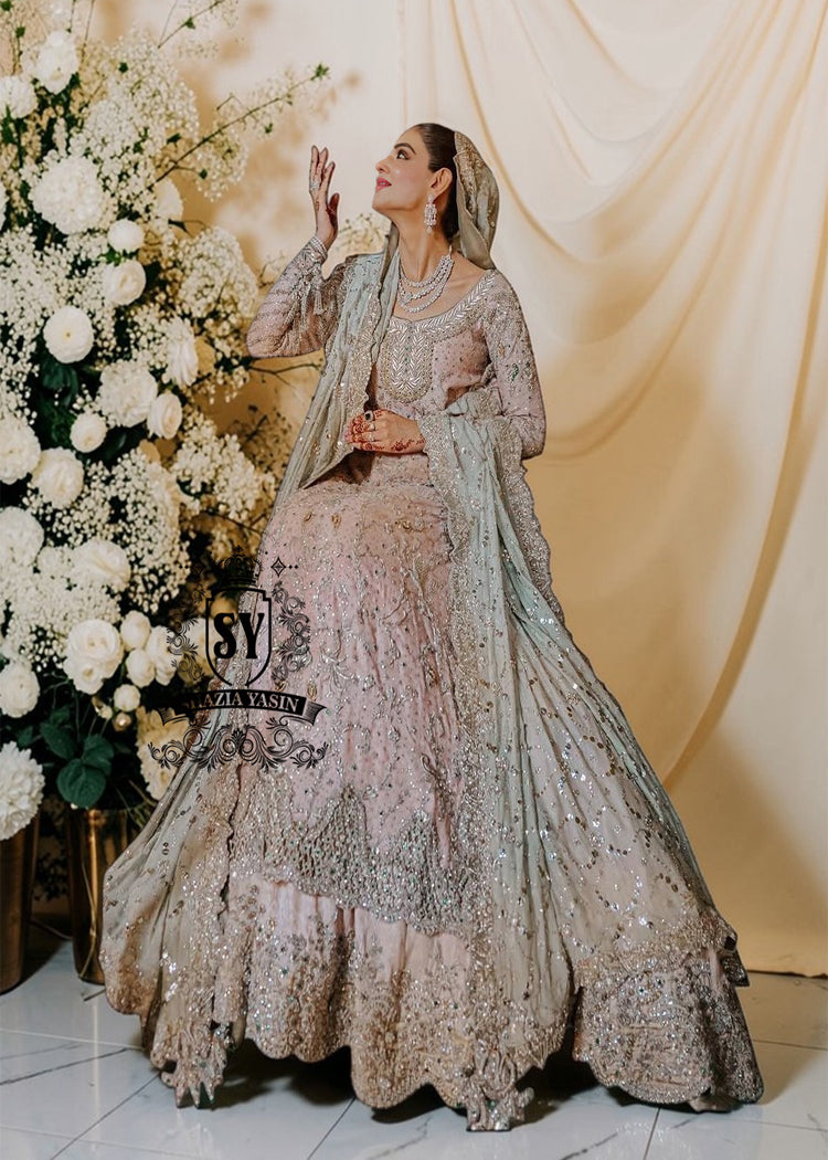 You can conquer the world! Exclusive Bridal dress style with perfect Lehenga lines. Underline your status with Fair Pink Wedding dress.