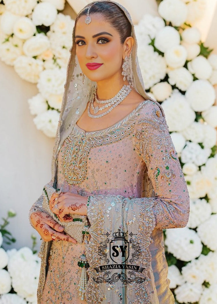 You can conquer the world! Exclusive Bridal dress style with perfect Lehenga lines. Underline your status with Fair Pink Wedding dress.