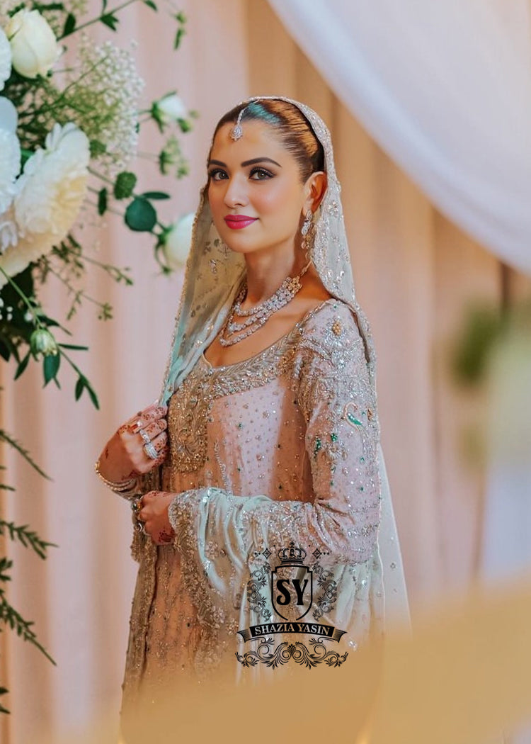 You can conquer the world! Exclusive Bridal dress style with perfect Lehenga lines. Underline your status with Fair Pink Wedding dress.