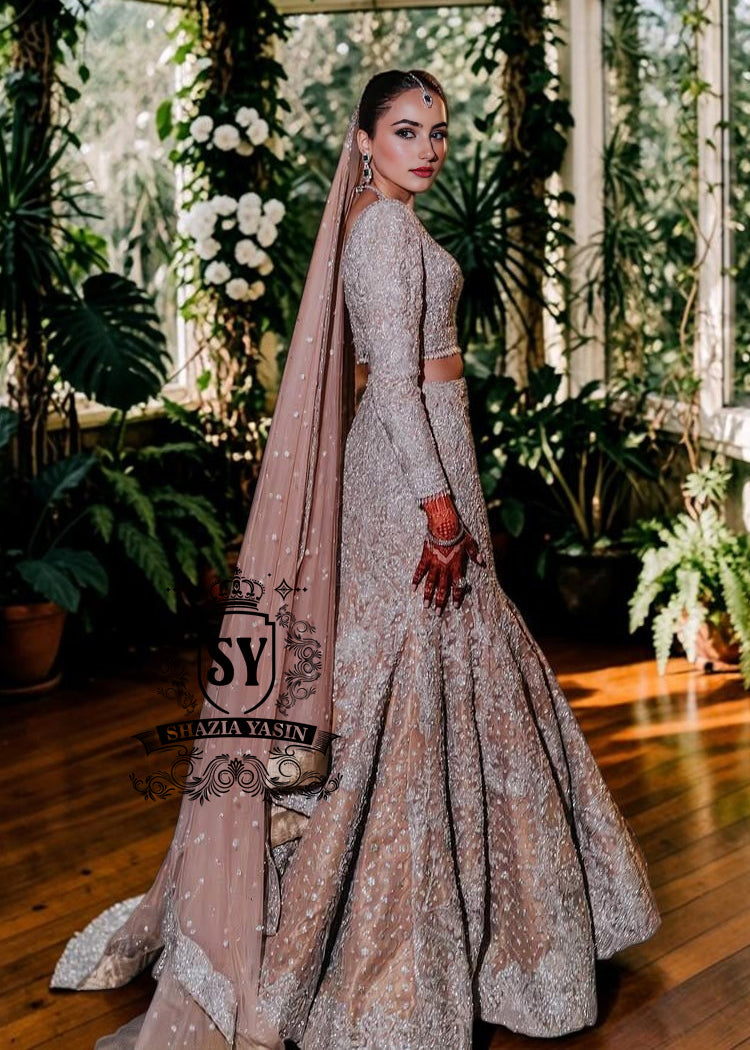Mermaid wedding dress by Shazia Yasin. Elegant Lehenga design, high-quality fabrics, and a perfect fit for your special day. The unique design of a mermaid wedding dress always makes an impression, and with our Lehenga Choli designs, you'll win the hearts of your guests. See for yourself!