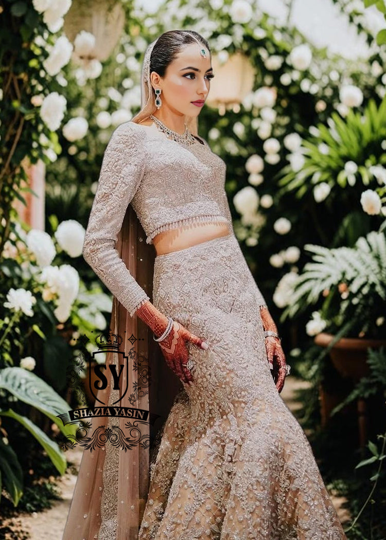 Mermaid wedding dress by Shazia Yasin. Elegant Lehenga design, high-quality fabrics, and a perfect fit for your special day. The unique design of a mermaid wedding dress always makes an impression, and with our Lehenga Choli designs, you'll win the hearts of your guests. See for yourself!