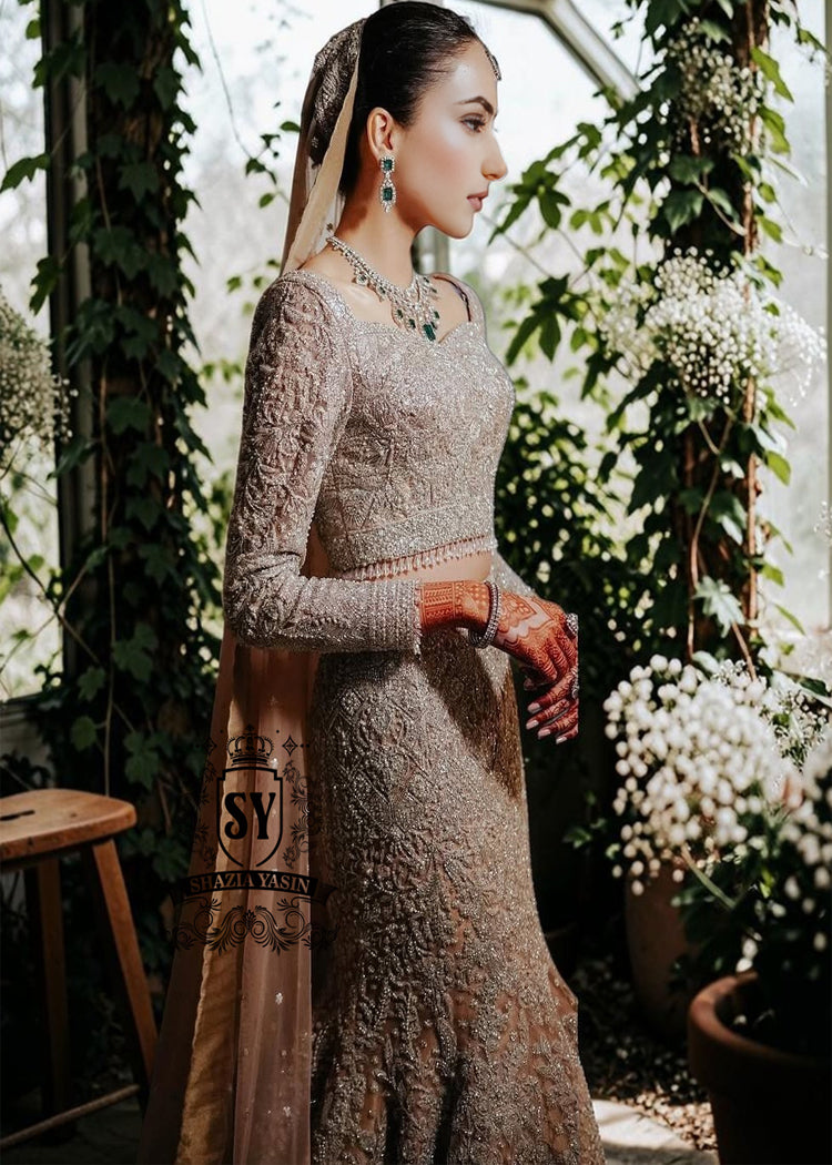 Mermaid wedding dress by Shazia Yasin. Elegant Lehenga design, high-quality fabrics, and a perfect fit for your special day. The unique design of a mermaid wedding dress always makes an impression, and with our Lehenga Choli designs, you'll win the hearts of your guests. See for yourself!