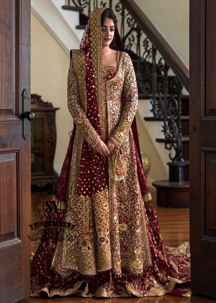 A wedding dress with a long train lehenga embroidered with crystals, created for an unparalleled look for the bride. The delicate embellishments softly sparkles with every movement, while the wedding gown silhouette beautifully highlights her natural elegance.