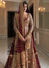 A wedding dress with a long train lehenga embroidered with crystals, created for an unparalleled look for the bride. The delicate embellishments softly sparkles with every movement, while the wedding gown silhouette beautifully highlights her natural elegance.