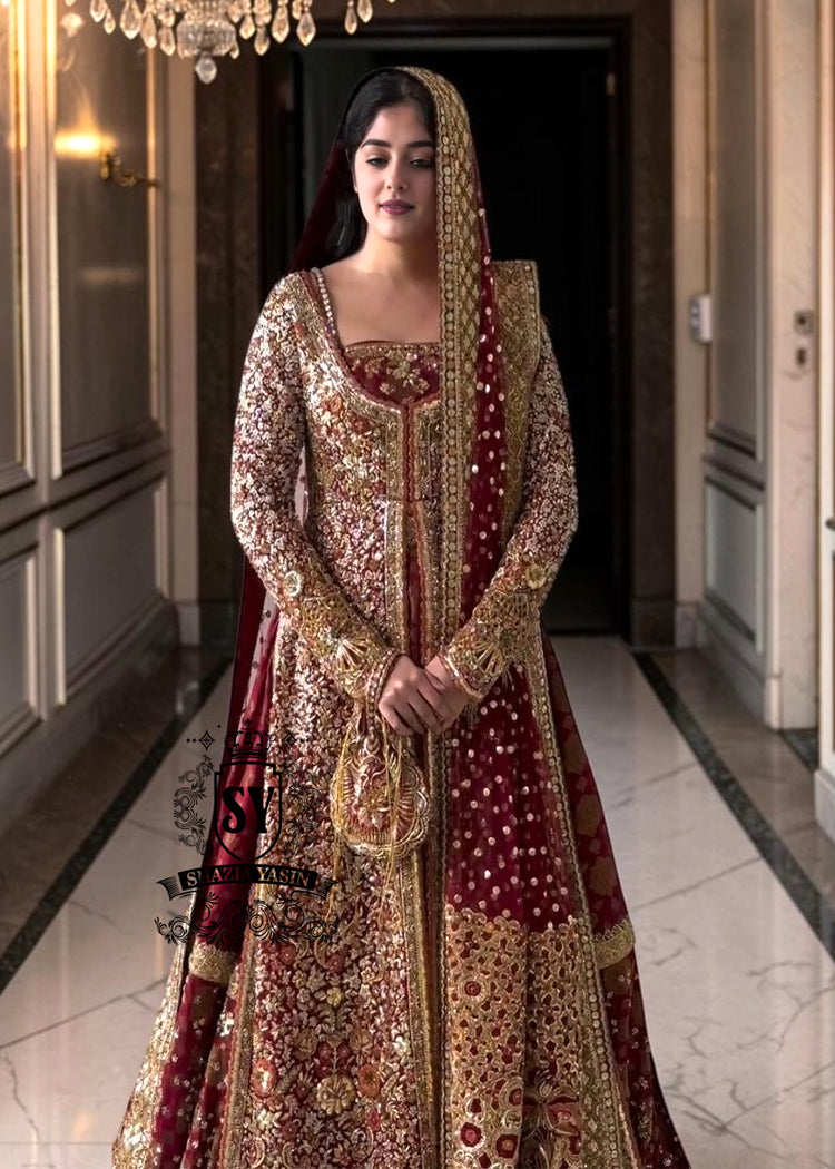 A wedding dress with a long train lehenga embroidered with crystals, created for an unparalleled look for the bride. The delicate embellishments softly sparkles with every movement, while the wedding gown silhouette beautifully highlights her natural elegance.
