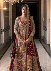 A wedding dress with a long train lehenga embroidered with crystals, created for an unparalleled look for the bride. The delicate embellishments softly sparkles with every movement, while the wedding gown silhouette beautifully highlights her natural elegance.