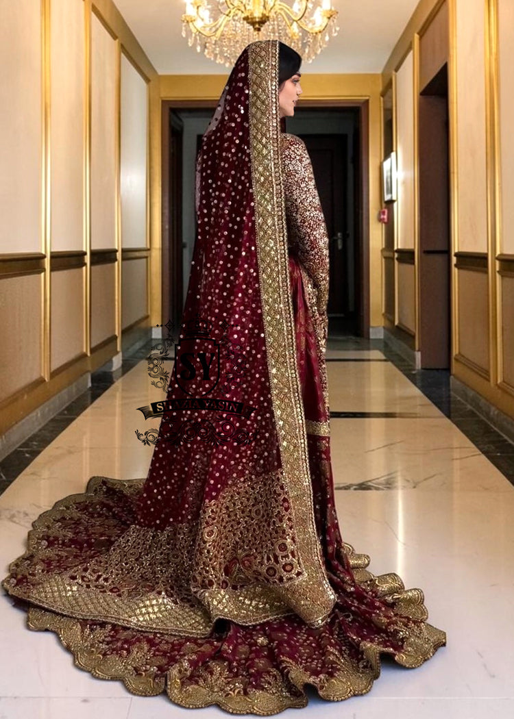 A wedding dress with a long train lehenga embroidered with crystals, created for an unparalleled look for the bride. The delicate embellishments softly sparkles with every movement, while the wedding gown silhouette beautifully highlights her natural elegance.