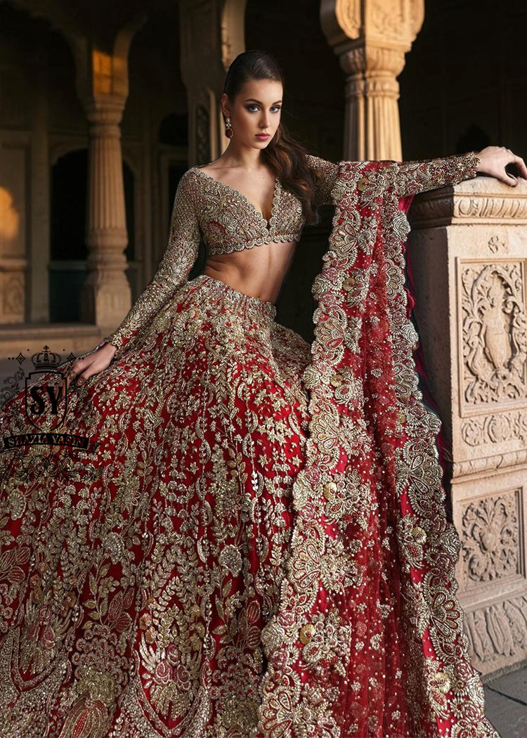 This Angels Red bridal dress is the epitome of grace and grandeur — a wedding lehenga choli dress crafted to perfection for your big day. Full of shine and feminine charm, this is a perfect choice for brides who want to subtly shine on their big day.