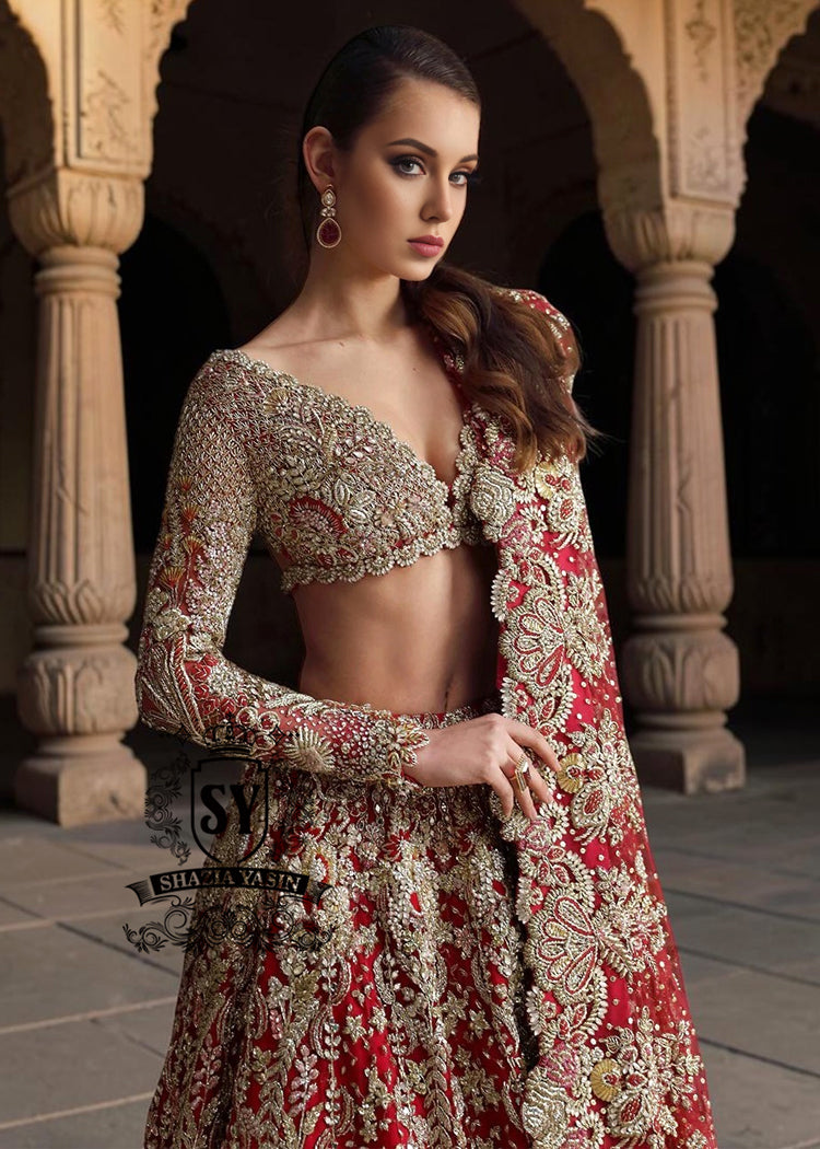 This Angels Red bridal dress is the epitome of grace and grandeur — a wedding lehenga choli dress crafted to perfection for your big day. Full of shine and feminine charm, this is a perfect choice for brides who want to subtly shine on their big day.