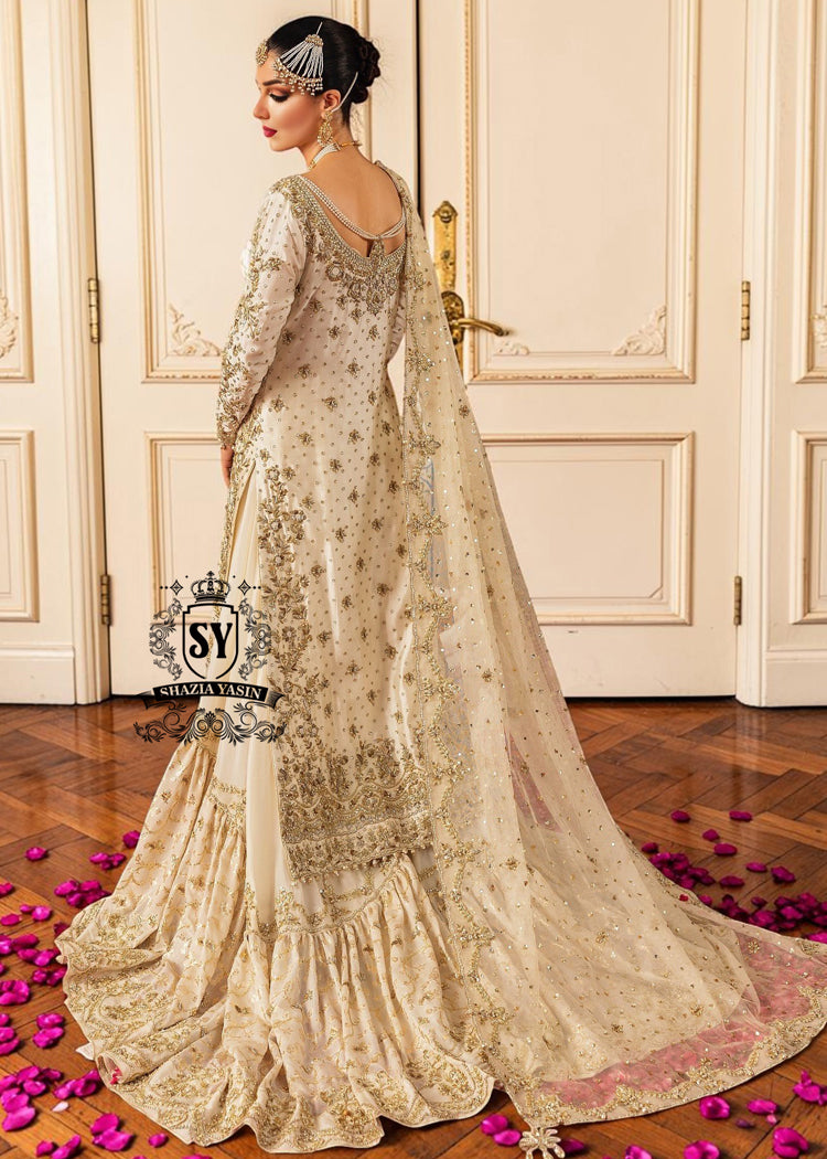 Ivory Heavily Embellished wedding dress with open back and full farshi gharara skirt, seen from behind.