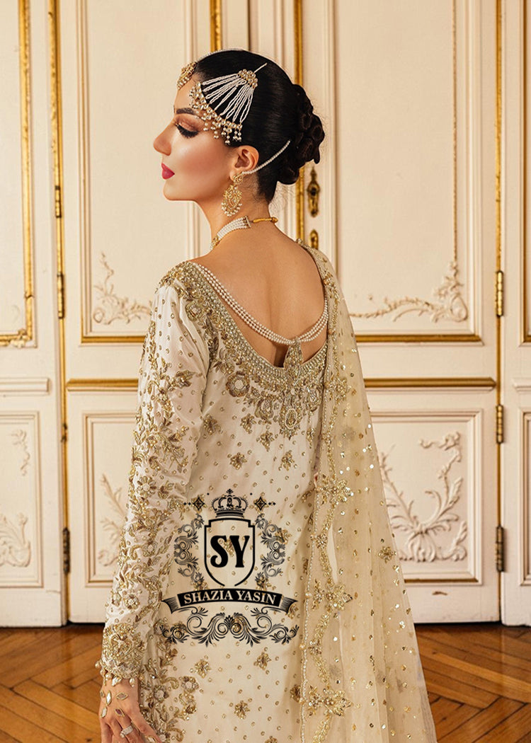 Ivory wedding dress with floral embellished back and pearl details.