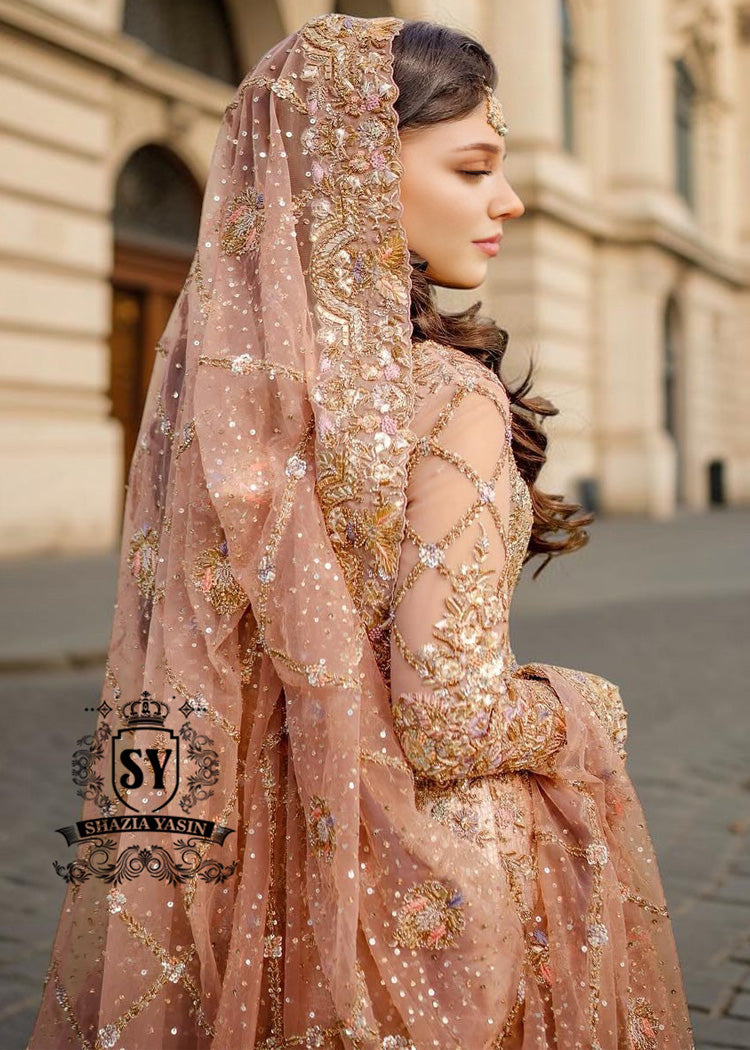 The dreamlike Gown & Lehenga silhouette, Straight out of fairy tale. Undeniably eye-catching, sparkly bridal dress is ideal for the bride seeking romance and glamor. This illuminating element reflects light beautifully adding enchanting details from head to toe.