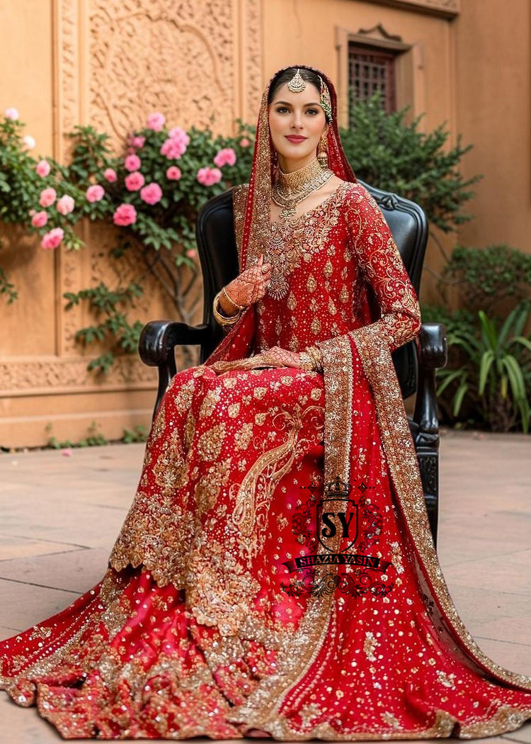 Radiating pure Amaranth Red bridal dress magic with two legged farshi lehenga. A perfect balance of grandeur and simplicity.