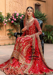 Radiating pure Amaranth Red bridal dress magic with two legged farshi lehenga. A perfect balance of grandeur and simplicity.