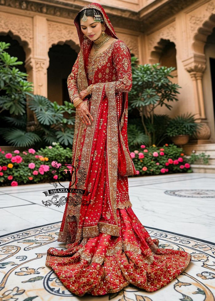 Radiating pure Amaranth Red bridal dress magic with two legged farshi lehenga. A perfect balance of grandeur and simplicity.