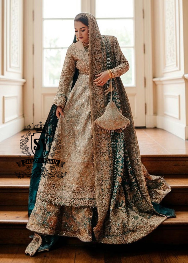 A royal look for a Full-figured bride will be created by this A-line long shirt with farshi lehenga dress made of luxurious lame fabric in Tradewind color.