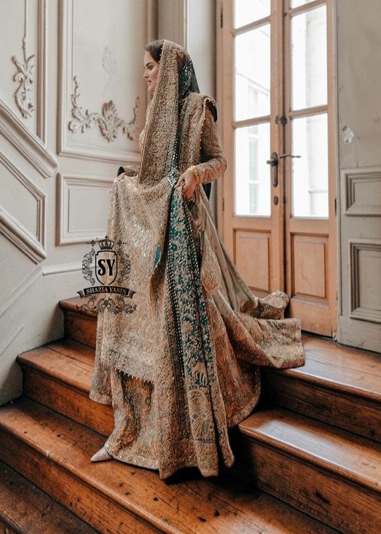 A royal look for a Full-figured bride will be created by this A-line long shirt with farshi lehenga dress made of luxurious lame fabric in Tradewind color.