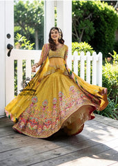 A dream transformed into elegance. This unique Lehenga Peplum design, gliding effortlessly against your skin with the lightness of silk tulle, evokes a fairy tale with every step.
