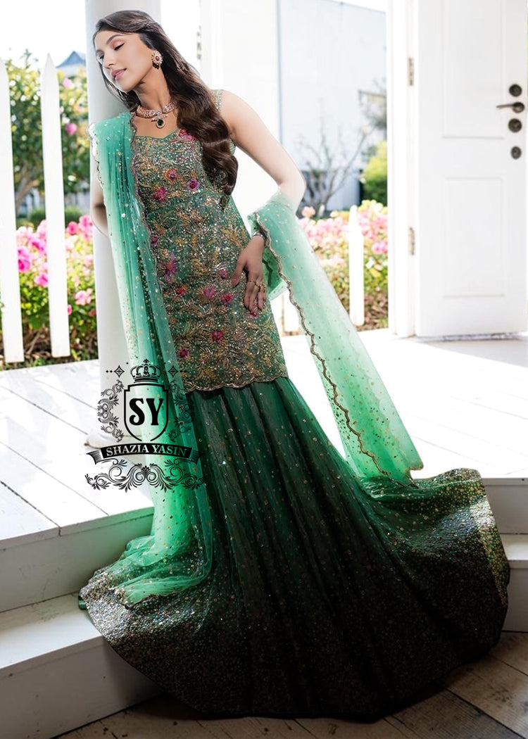 The moment you put on this bridal dress, you will feel like the star of a fairy tale. Rich and yet airy, this look combines a body-con kameez silhouette with a shimmering lehenga skirt.