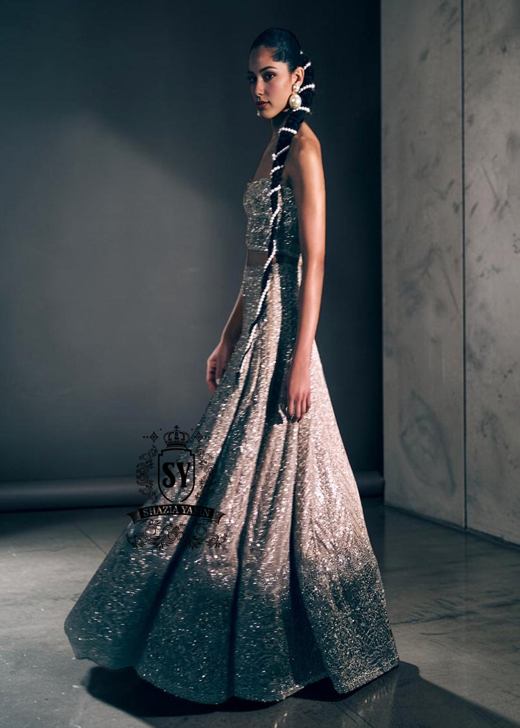 A luxurious bridal look, created by designers to fulfill your dream of a magnificent, fairytale-like bridal dress. Imagine yourself dancing in this bridal Lehenga Choli dress at the wedding hall, and you'll never want anything else. It's a stunning, super contemporary Lehenga design that definitely won't go unnoticed.
