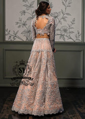 This modern open-back design bespoke bridal Lehenga choli dress is a celebration of romance and craftsmanship — adorned with tens of thousands of hand-sewn crystals that glisten like stardust on layers of ethereal tulle.