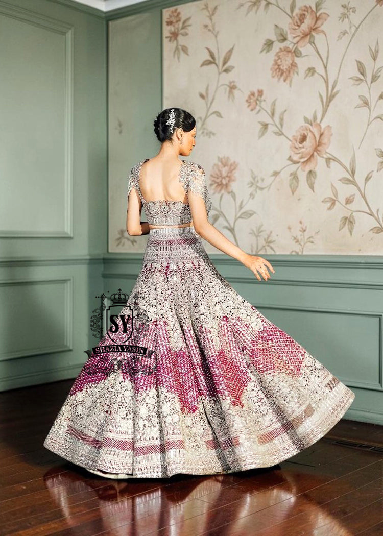 This back of the Lehenga choli Bridal dress is the embodiment of royal grandeur. A stunning wedding dress, every detail of which is designed to captivate. Exquisite embellishments, a sophisticated blouse, luxurious Beaded sleeves, and a delicate neckline create a truly aristocratic bride.