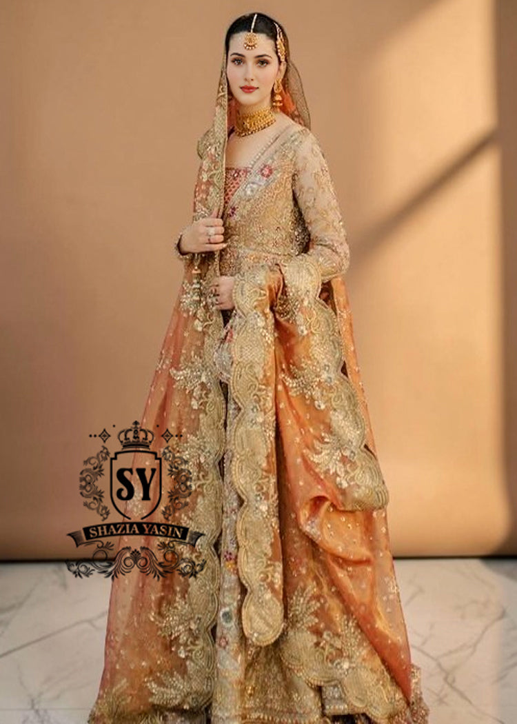 The Sultry beige color adds a modern touch to the traditional wedding dress. This ensemble is perfect for brides who want to combine classic elegance with contemporary fashion. A premium Pishwas Lehenga design ideal for brides seeking an elegant, sophisticated, and striking look.