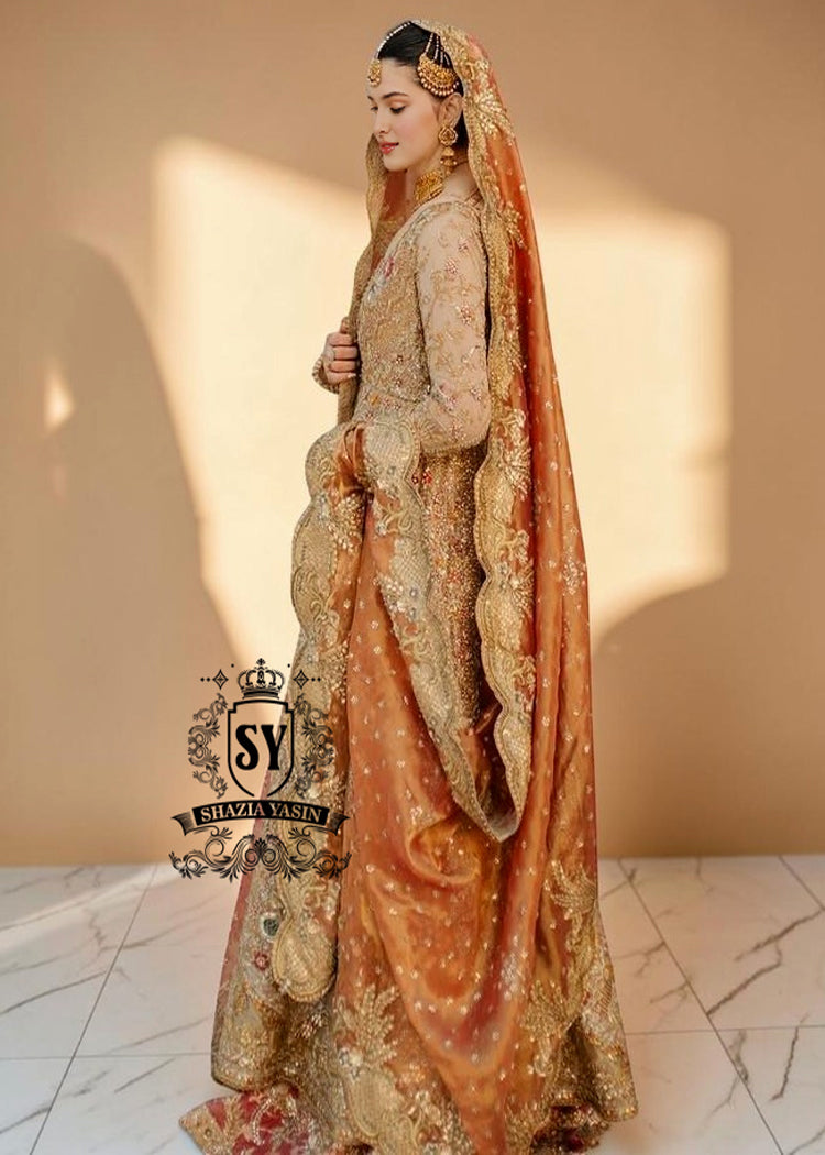 The Sultry beige color adds a modern touch to the traditional wedding dress. This ensemble is perfect for brides who want to combine classic elegance with contemporary fashion. A premium Pishwas Lehenga design ideal for brides seeking an elegant, sophisticated, and striking look.