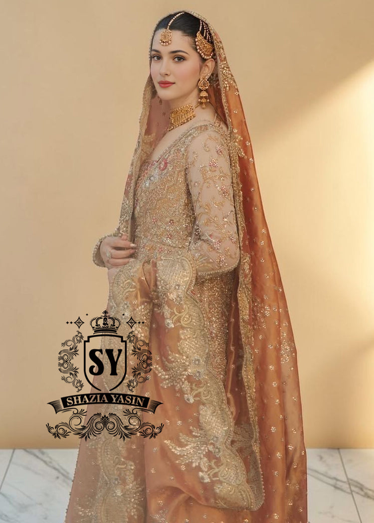 The Sultry beige color adds a modern touch to the traditional wedding dress. This ensemble is perfect for brides who want to combine classic elegance with contemporary fashion. A premium Pishwas Lehenga design ideal for brides seeking an elegant, sophisticated, and striking look.