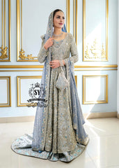 Discover Shazia Yasin’s Silver Chalice Bridal Dress with Blue Haze Lehenga, exquisitely embellished with silver zardozi and crystal embroidery. Perfect for engagement, Nikah or walima brides, this outfit captures royal tradition and luxury.