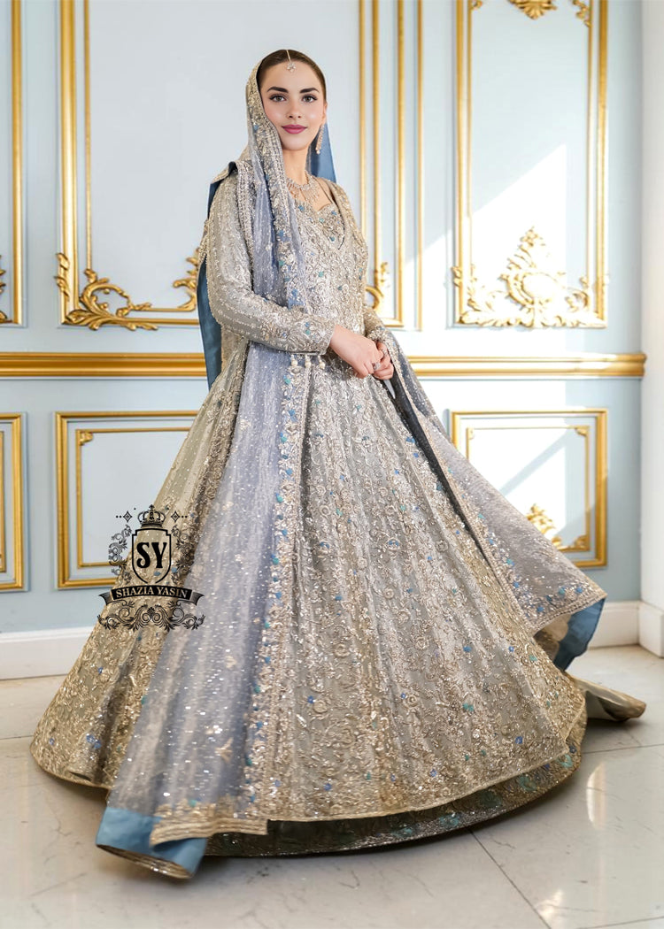 Discover Shazia Yasin’s Silver Chalice Bridal Dress with Blue Haze Lehenga, exquisitely embellished with silver zardozi and crystal embroidery. Perfect for engagement, Nikah or walima brides, this outfit captures royal tradition and luxury.