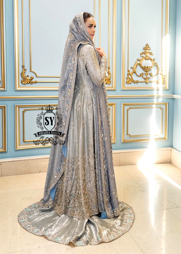 Discover Shazia Yasin’s Silver Chalice Bridal Dress with Blue Haze Lehenga, exquisitely embellished with silver zardozi and crystal embroidery. Perfect for engagement, Nikah or walima brides, this outfit captures royal tradition and luxury.