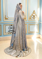 Discover Shazia Yasin’s Silver Chalice Bridal Dress with Blue Haze Lehenga, exquisitely embellished with silver zardozi and crystal embroidery. Perfect for engagement, Nikah or walima brides, this outfit captures royal tradition and luxury.