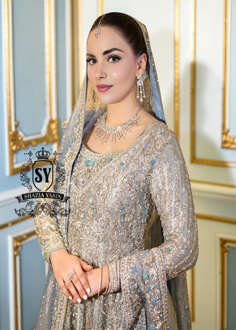 Discover Shazia Yasin’s Silver Chalice Bridal Dress with Blue Haze Lehenga, exquisitely embellished with silver zardozi and crystal embroidery. Perfect for engagement, Nikah or walima brides, this outfit captures royal tradition and luxury.