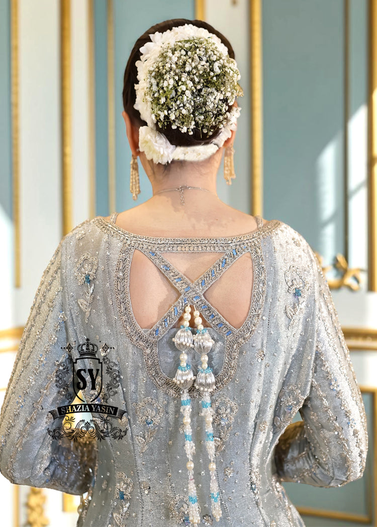 Discover Shazia Yasin’s Silver Chalice Bridal Dress with Blue Haze Lehenga, exquisitely embellished with silver zardozi and crystal embroidery. Perfect for engagement, Nikah or walima brides, this outfit captures royal tradition and luxury.