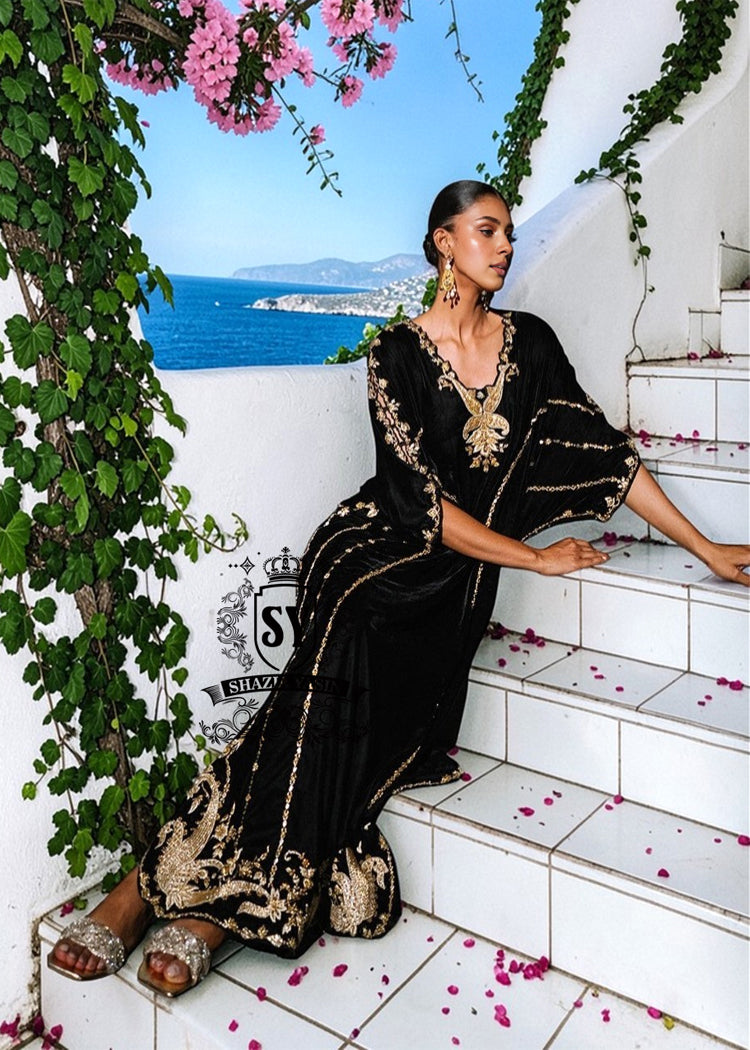 Be dazzling with this elegant black velvet Kaftan dress. Designed with both classic and modern lines, black velvet Kaftan dresses add a sophisticated touch to your wardrobe. Experience the elegance of this unique Embellished Kaftan at Shazia Yasin.