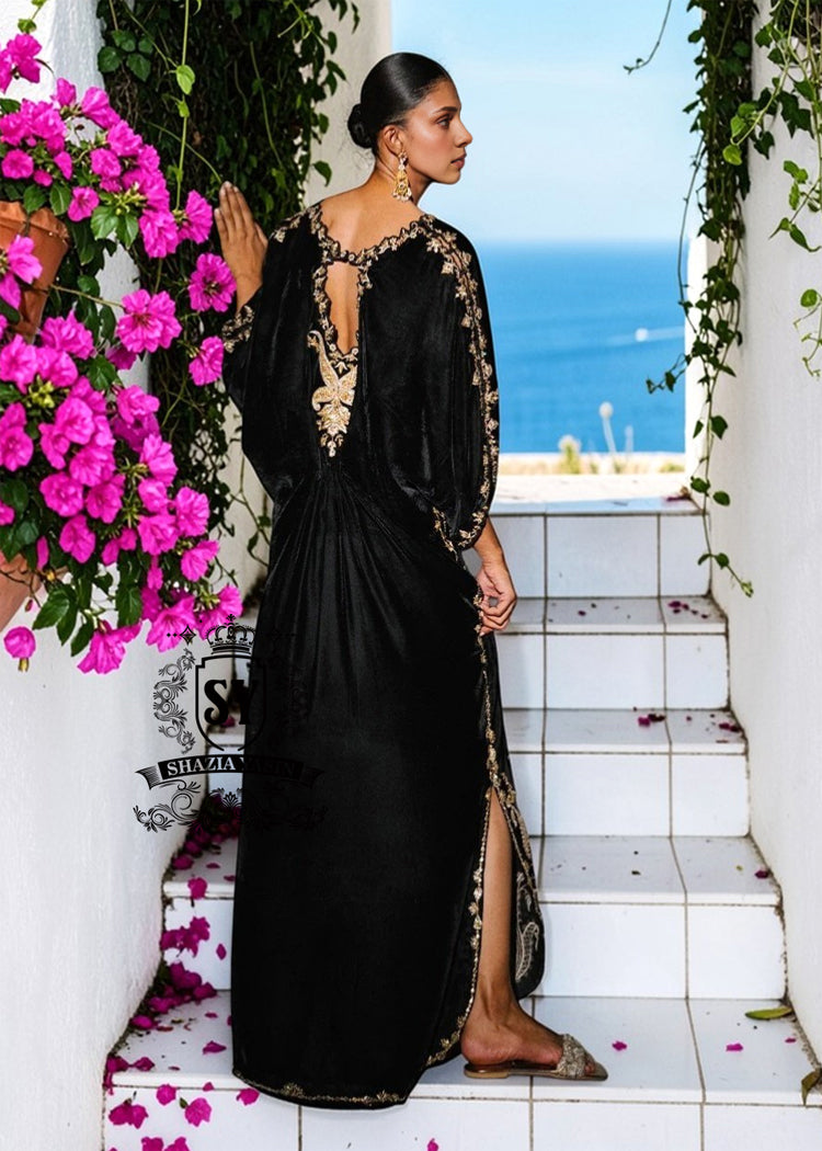 Be dazzling with this elegant black velvet Kaftan dress. Designed with both classic and modern lines, black velvet Kaftan dresses add a sophisticated touch to your wardrobe. Experience the elegance of this unique Embellished Kaftan at Shazia Yasin.