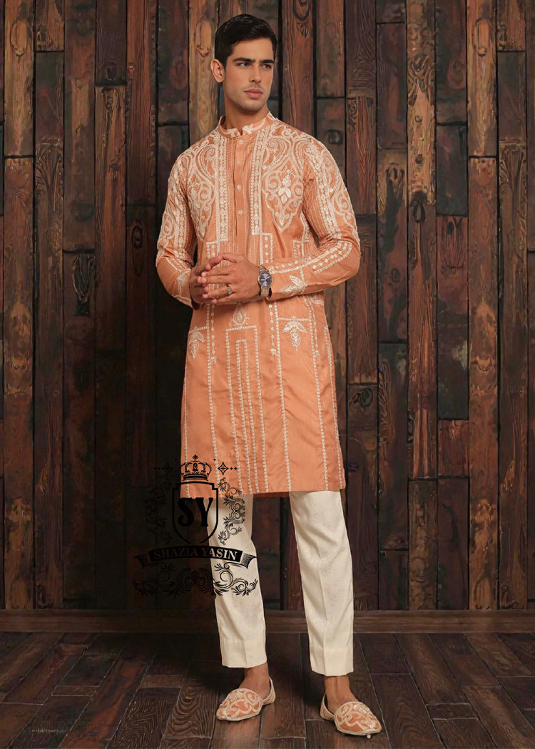 Expertly embroidered for a sophisticated look, the SY Couture Peach Men's Kurta Pajama is the perfect blend of style and comfort. Made with high-quality fabric, it features an elegant design and superior stitching for a lasting impression. Elevate your wardrobe with this timeless piece for any occasion.