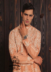 Expertly embroidered for a sophisticated look, the SY Couture Peach Men's Kurta Pajama is the perfect blend of style and comfort. Made with high-quality fabric, it features an elegant design and superior stitching for a lasting impression. Elevate your wardrobe with this timeless piece for any occasion.