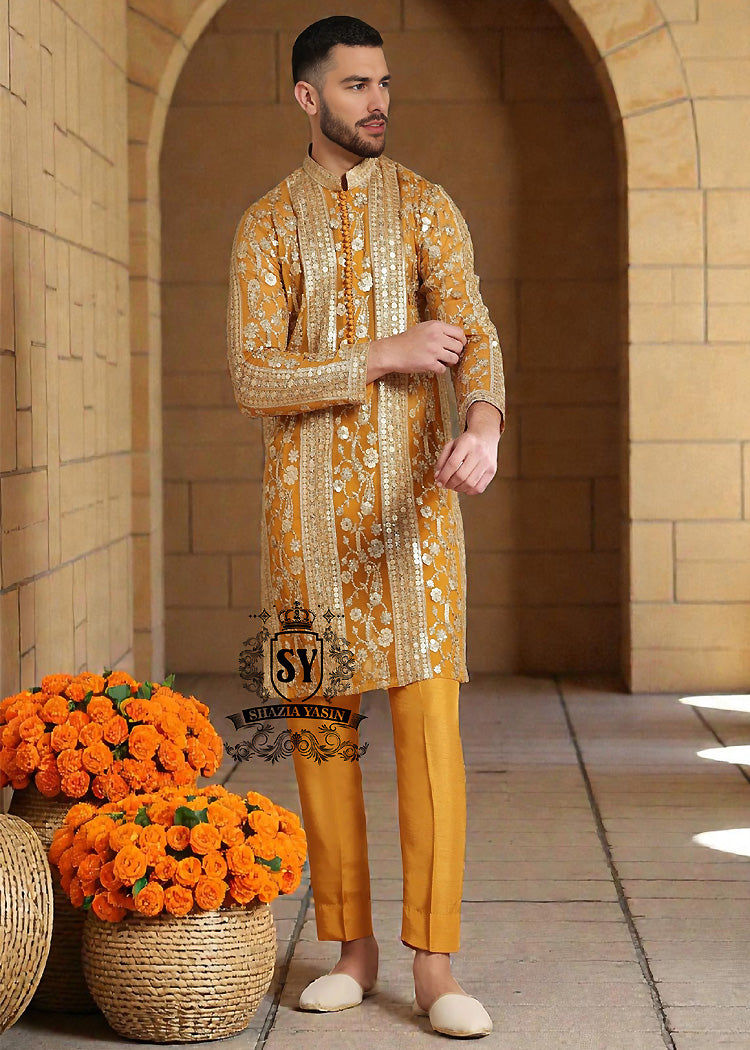 A luxurious mustard-gold kurta adorned with delicate floral and geometric embroidery — created for the man who believes in elegance, heritage, and refined festive style.