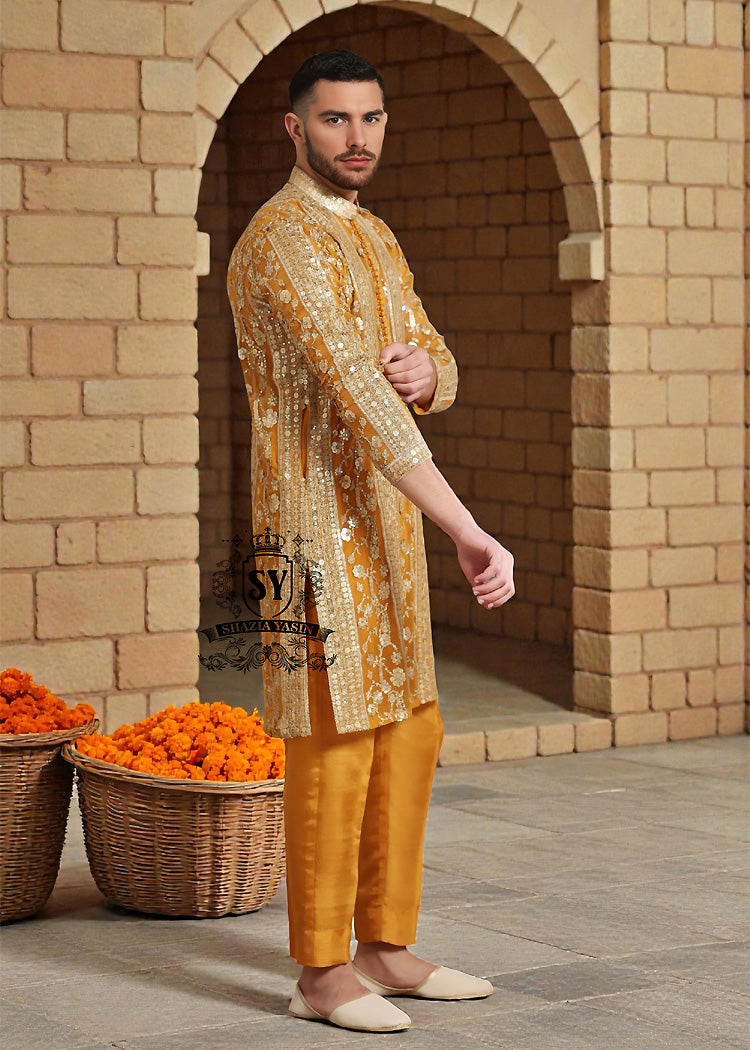 A luxurious mustard-gold kurta adorned with delicate floral and geometric embroidery — created for the man who believes in elegance, heritage, and refined festive style.