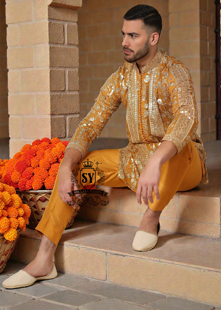 A luxurious mustard-gold kurta adorned with delicate floral and geometric embroidery — created for the man who believes in elegance, heritage, and refined festive style.