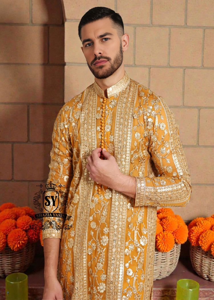 A luxurious mustard-gold kurta adorned with delicate floral and geometric embroidery — created for the man who believes in elegance, heritage, and refined festive style.