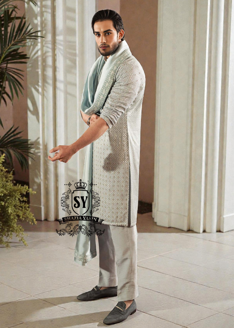 This exquisite kurta embodies sophisticated elegance and timeless grace. Crafted from the finest premium fabrics and meticulously designed with intricate embellishments and delicate sequin work, it exudes understated luxury.