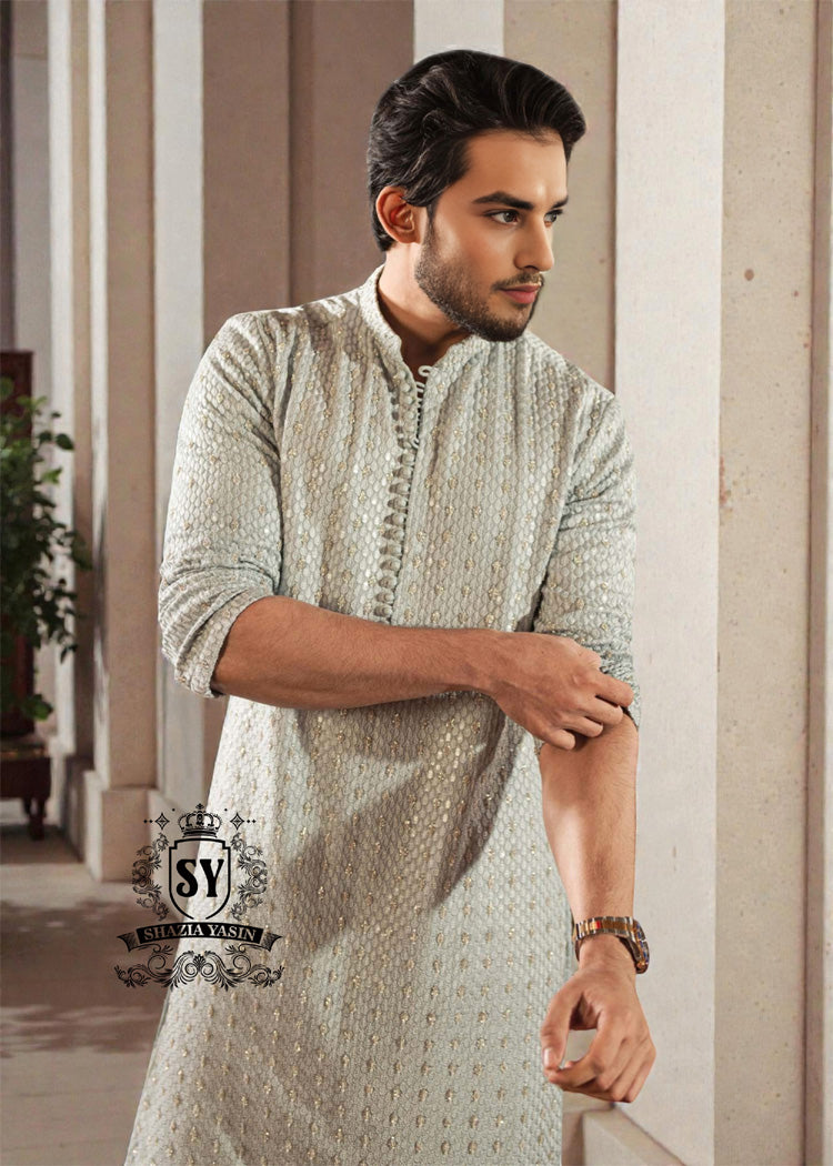 This exquisite kurta embodies sophisticated elegance and timeless grace. Crafted from the finest premium fabrics and meticulously designed with intricate embellishments and delicate sequin work, it exudes understated luxury.