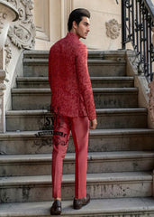 This Prince Coat embodies a mastery of proportion and structure. The prince coat, crafted from pure raw silk, features brick-red embroidery. Beneath it lies a silhouette that flows from a soft kurta to sharp, slim-fitting trousers.