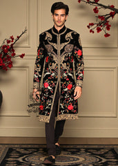 A Velvet sherwani crafted with refined detailing and florals elegance designed for the groom who lets craftsmanship speak louder than trends.