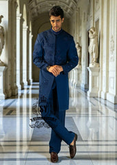 This Admiral Blue sherwani redefines elegance with its intricately executed tone-on-tone adah work, exuding a royal aura with a distinctive modern edge, embodying royal sophistication yet suited to the modern man.