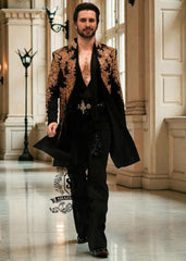 The intricate golden hand embroidery adds a touch of luxury and sophistication, making this a true Sherwani that will last a lifetime. Effortlessly sleek, perfectly tailored velvet Sherwani in Kokushoku Black— men’s cocktail fits designed for evenings that matter.