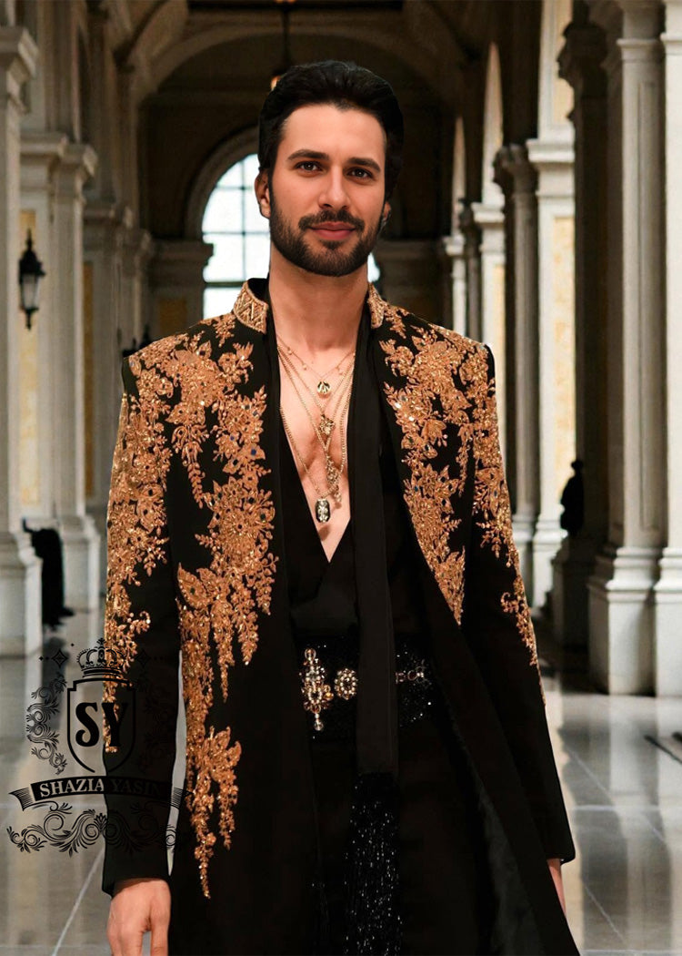 The intricate golden hand embroidery adds a touch of luxury and sophistication, making this a true Sherwani that will last a lifetime. Effortlessly sleek, perfectly tailored velvet Sherwani in Kokushoku Black— men’s cocktail fits designed for evenings that matter.
